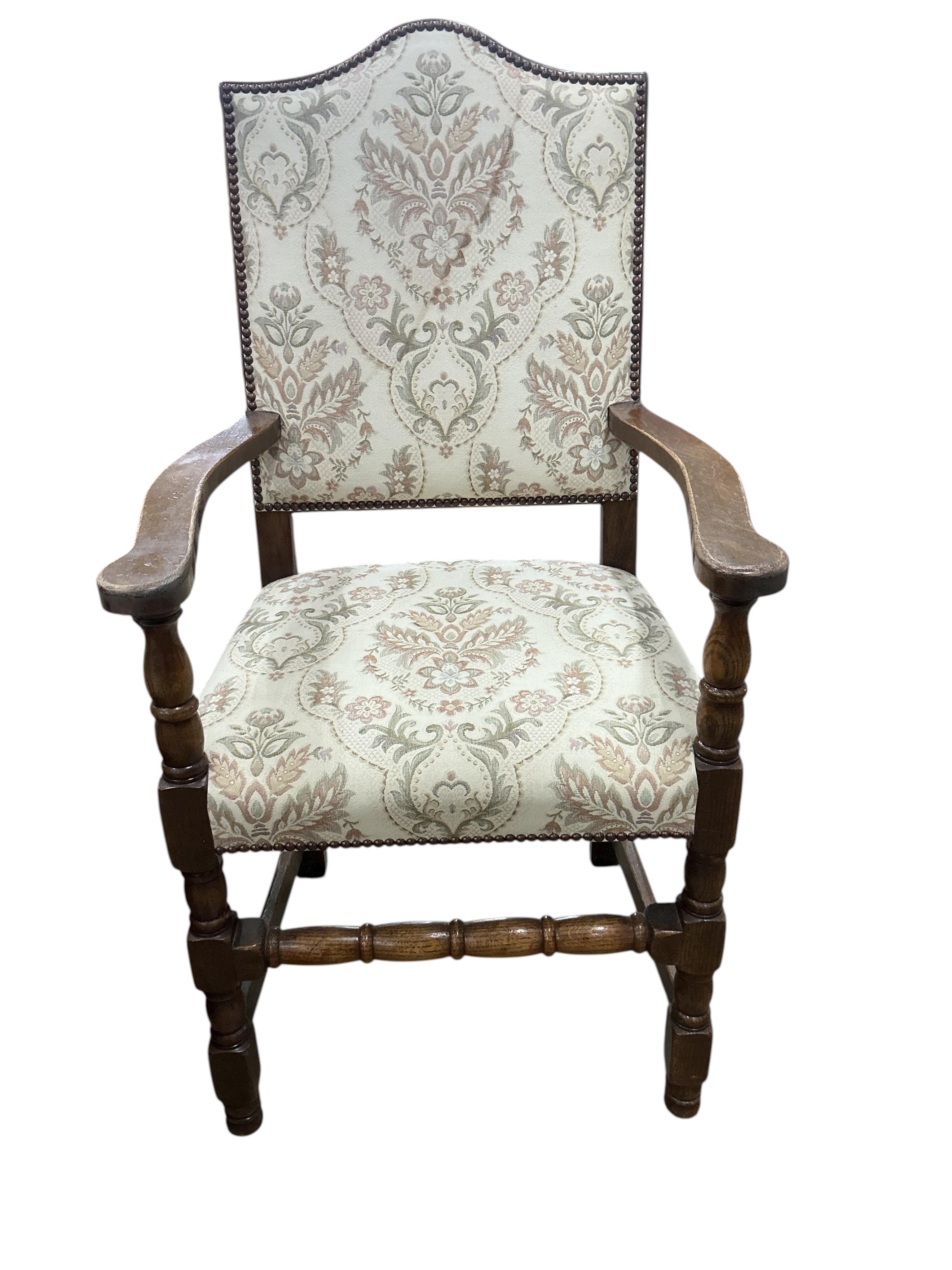 A set of eight 18th century style upholstered oak dining chairs, two with arms